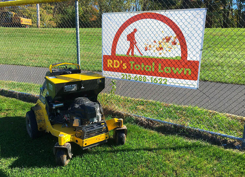 yellow aerator with sign in back